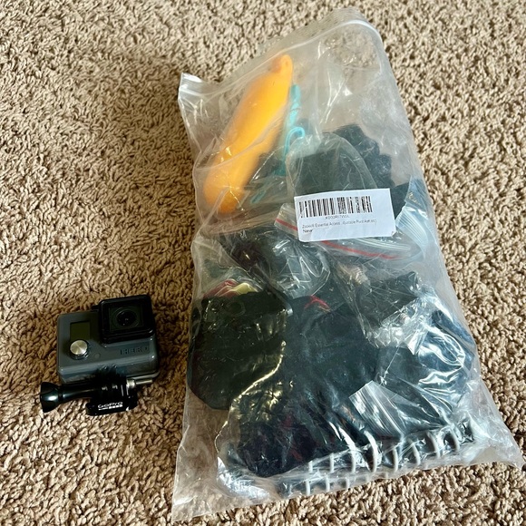 Go Pro with bag of unopened accessories. - Picture 2 of 5